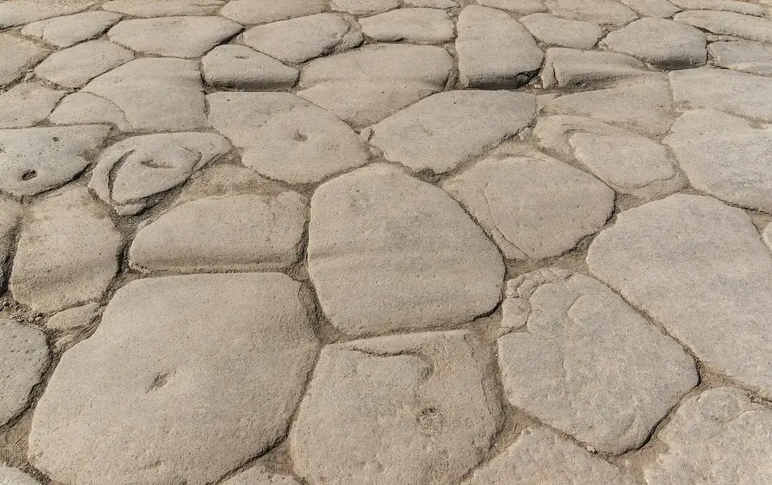 Worn stone paving on an old street