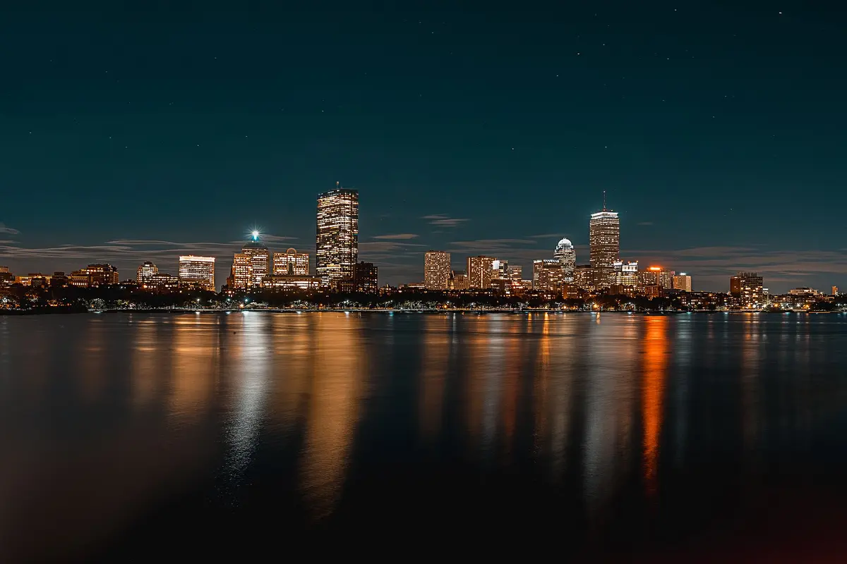City lights reflected across dark water